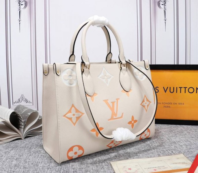 Louis Vuitton Monogram Empreinte Leather Onthego MM Bag In Cream Saffron - Louis Vuitton