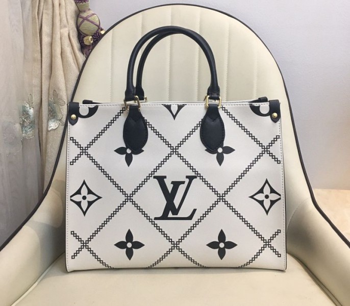 Louis Vuitton Spring 2022 Monogram Empreinte Onthego MM Tote In Cream - Louis Vuitton