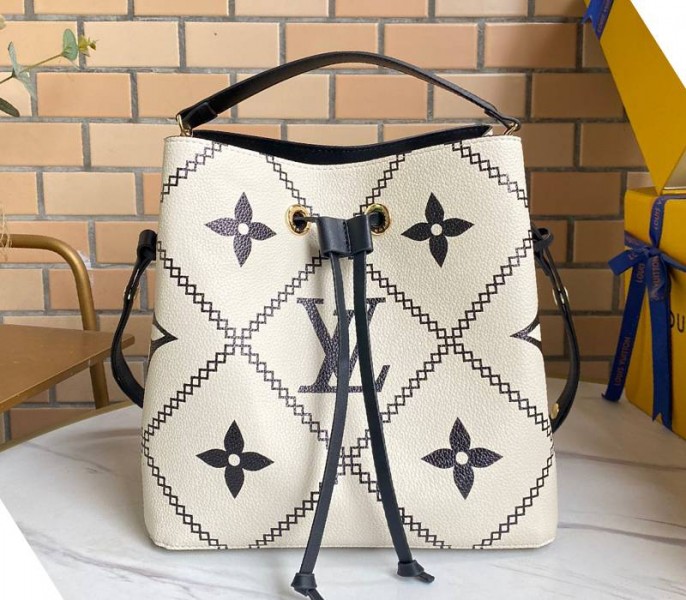Louis Vuitton Spring 2022 Monogram Empreinte NeoNoe MM Bag In Cream - Louis Vuitton