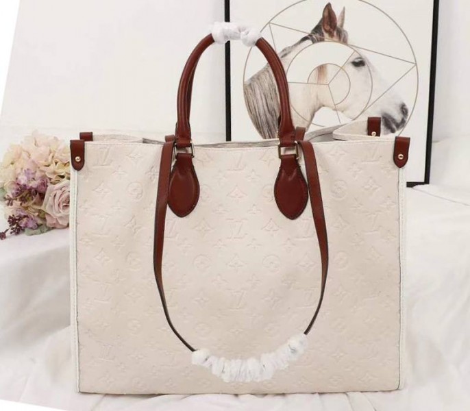 Louis Vuitton Monogram Empreinte Onthego GM Tote In Cream - Louis Vuitton