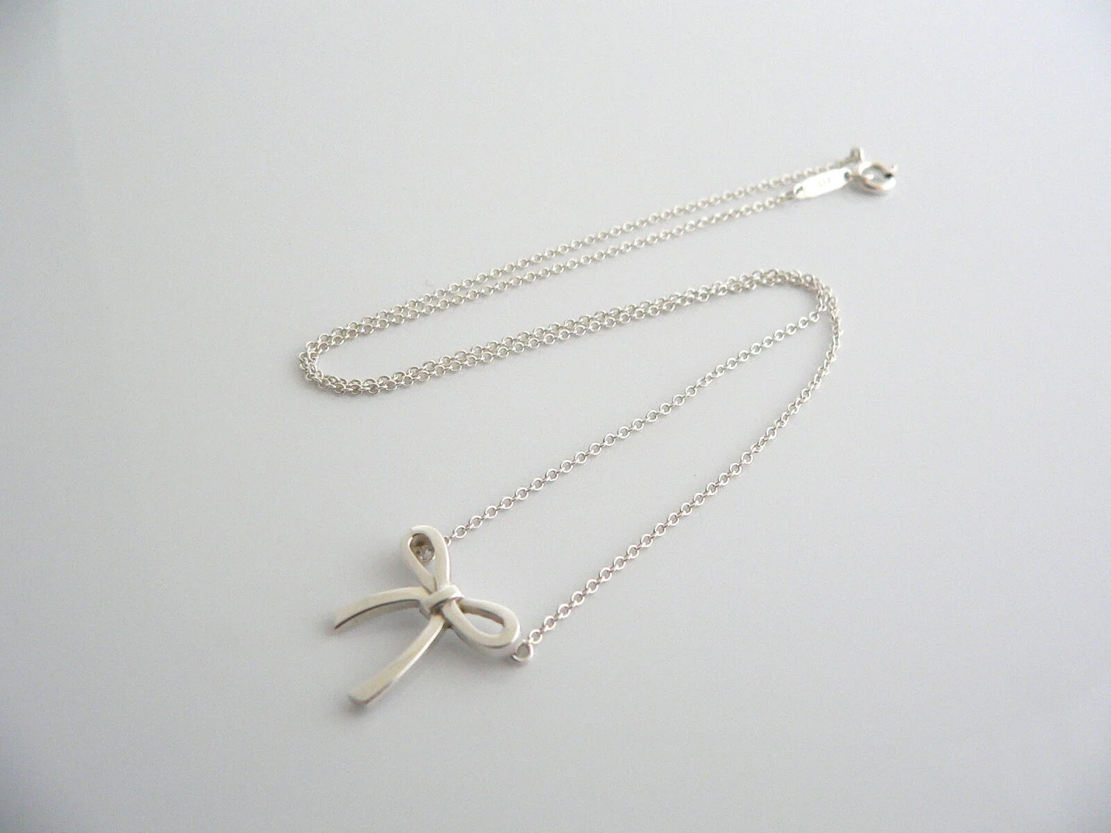 Tiffany & Co  Silver Ribbon Bow Necklace Pendant Charm Chain Gift Love