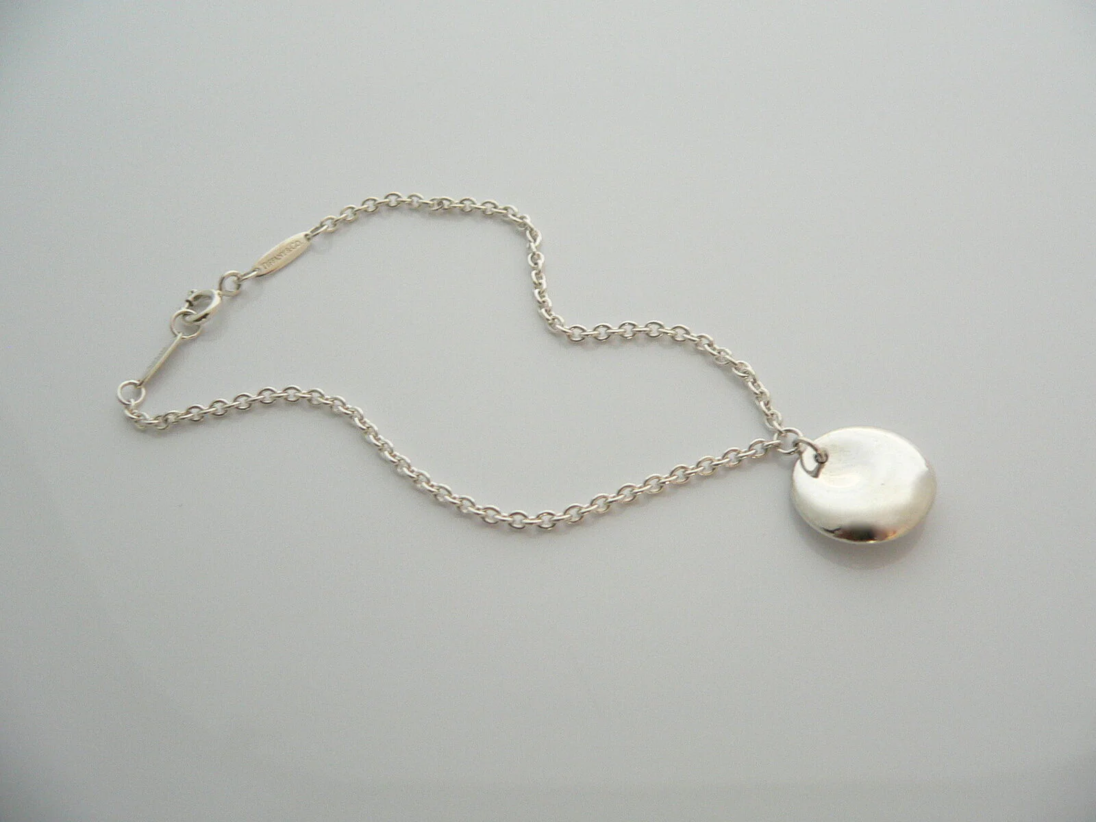 Tiffany & Co Silver Peretti Disc Circle Dangling Dangle Bracelet Bangle 7.25 Inch