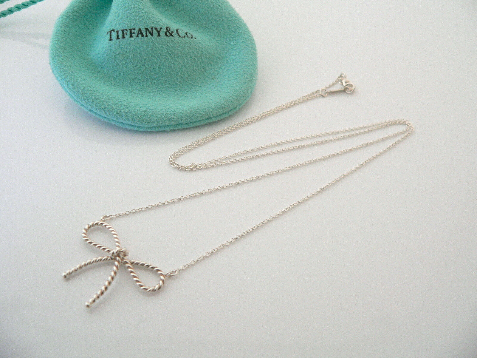 Tiffany & Co Silver Ribbon Necklace Twisted Bow Pendant Charm Chain Gift Pouch