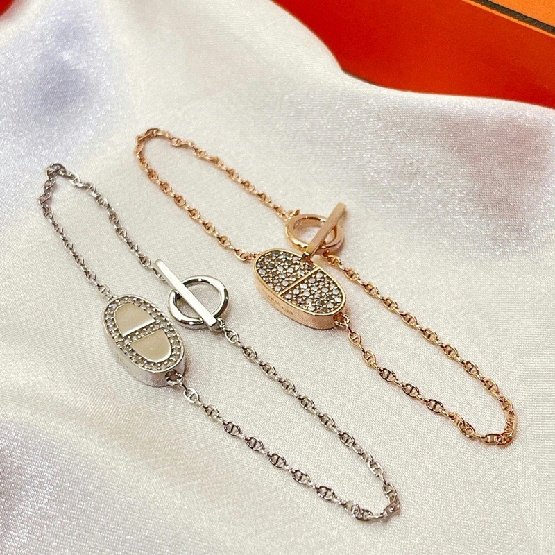 Hermes bracelet with half diamonds on one side and full diamonds on the other