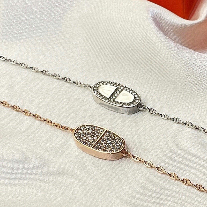 Hermes bracelet with half diamonds on one side and full diamonds on the other