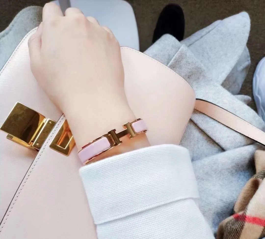 Hermes pink enameled bracelet with rose gold-tone border