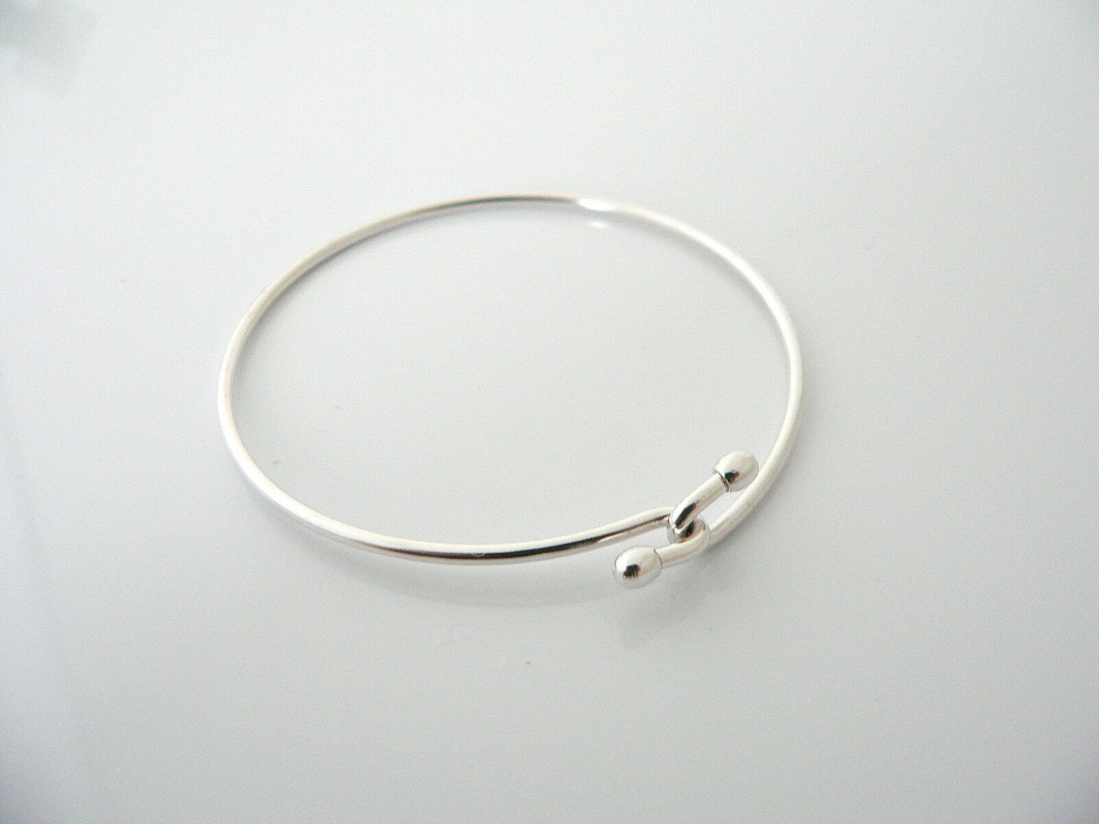 Tiffany & Co Silver Love Knot Hook Bangle Bracelet Infinity Interlocking Gift