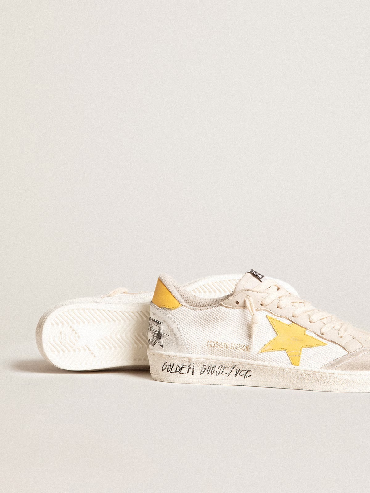 Golden Goose GGDB Ball Star LTD in white mesh with yellow leather star and heel tab