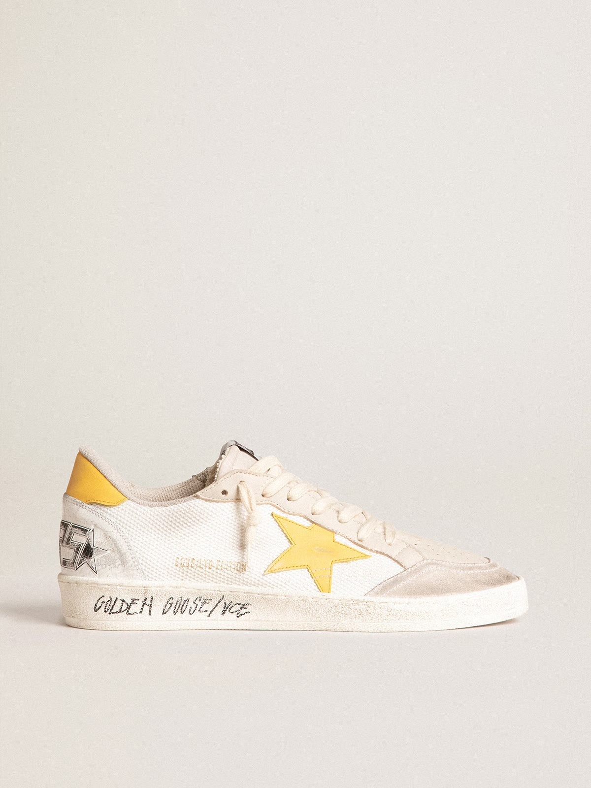 Golden Goose GGDB Ball Star LTD in white mesh with yellow leather star and heel tab