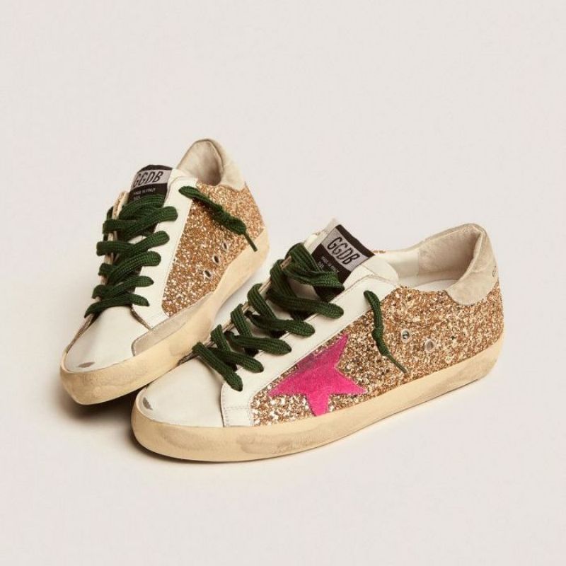 Golden Goose GGDB Super-Star sneakers in gold glitter with fluorescent pink suede star