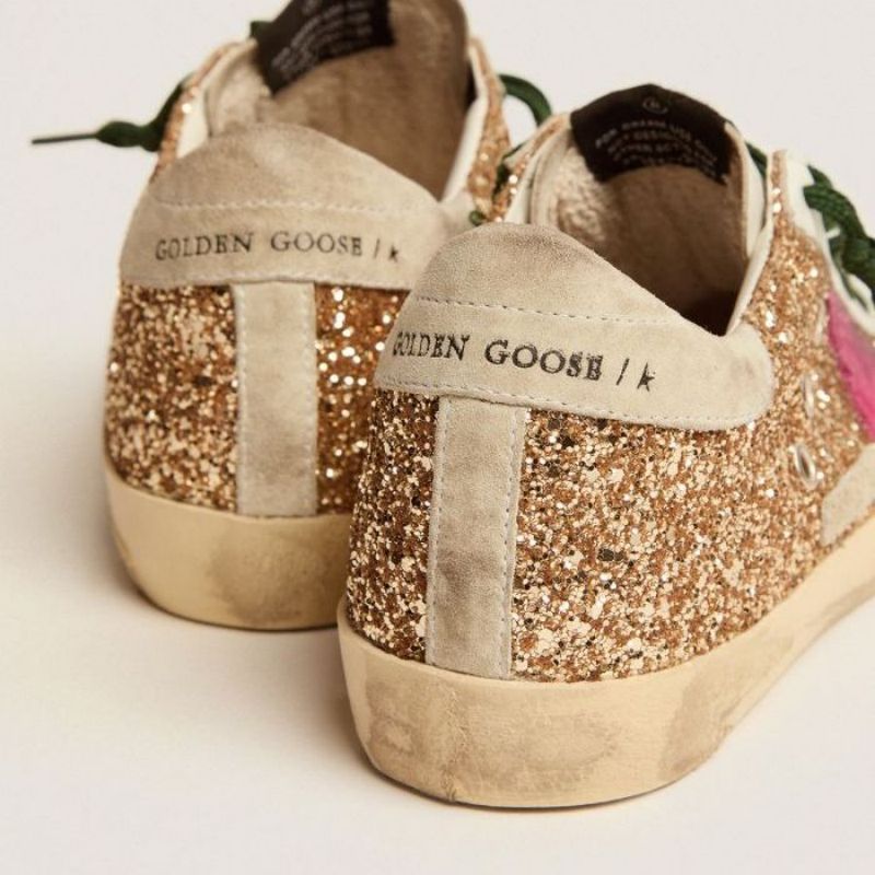 Golden Goose GGDB Super-Star sneakers in gold glitter with fluorescent pink suede star