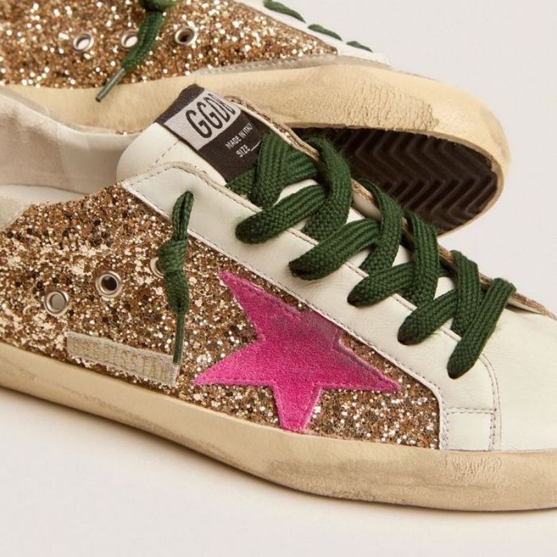 Golden Goose GGDB Super-Star sneakers in gold glitter with fluorescent pink suede star