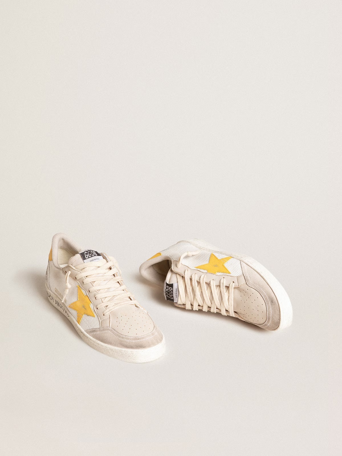 Golden Goose GGDB Ball Star LTD in white mesh with yellow leather star and heel tab