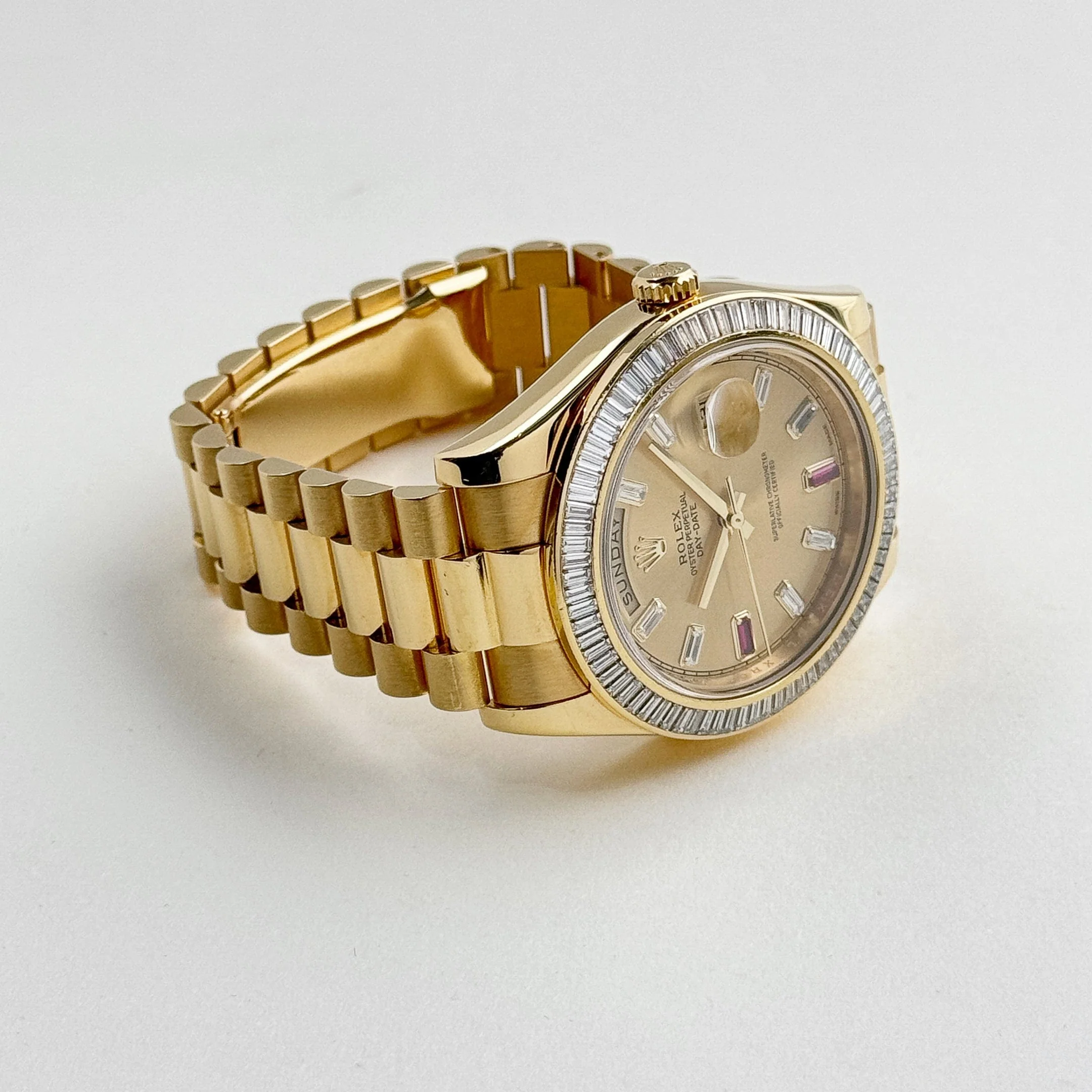 Rolex Day-Date II 218398 Yellow Gold Champagne Ruby Dial Diamond Bezel (2010)