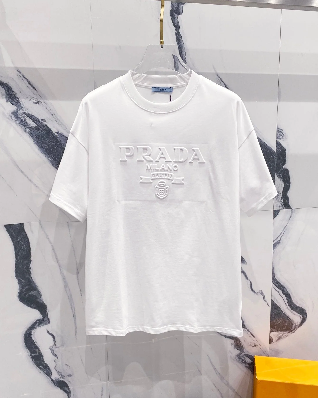 Three-dimensional embossed letter T-shirt